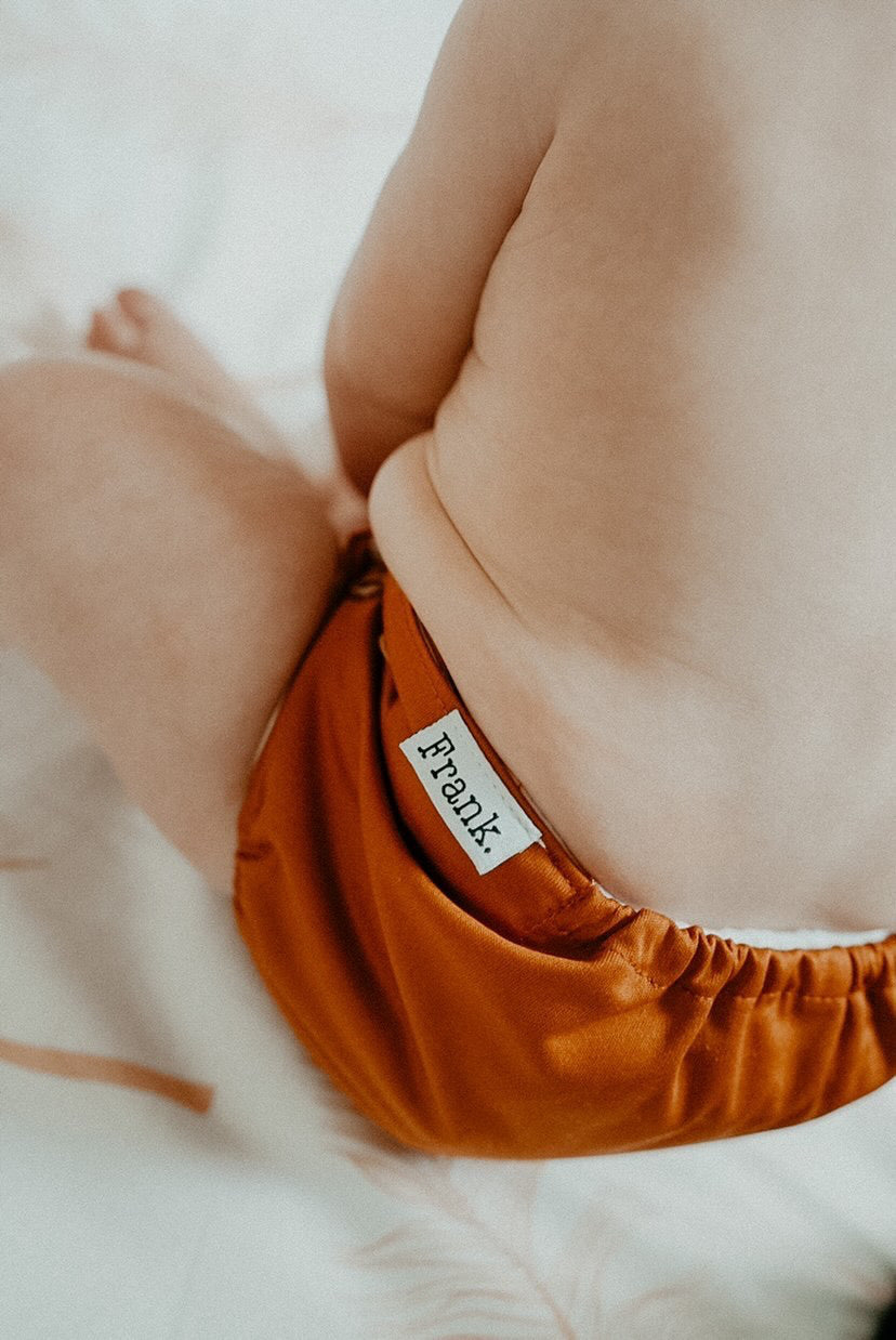 Comfy and cosy cloth nappy on the bum. Ethically made cloth nappies, designed in Australia. 