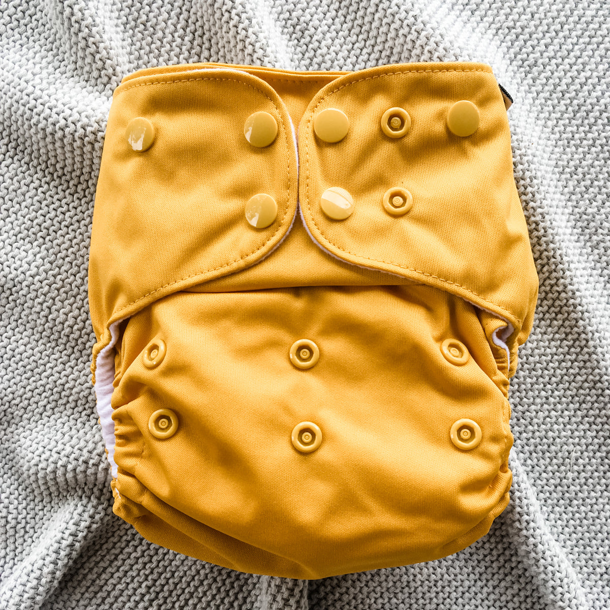 Frank Nappies have three rows of rise snaps to adjust fit around the legs. Many brands have only 2 rows of rise snaps. The extra row allows a snug fit on skinny newborn baby legs, whilst still accommodating the chubbiest of thighs.