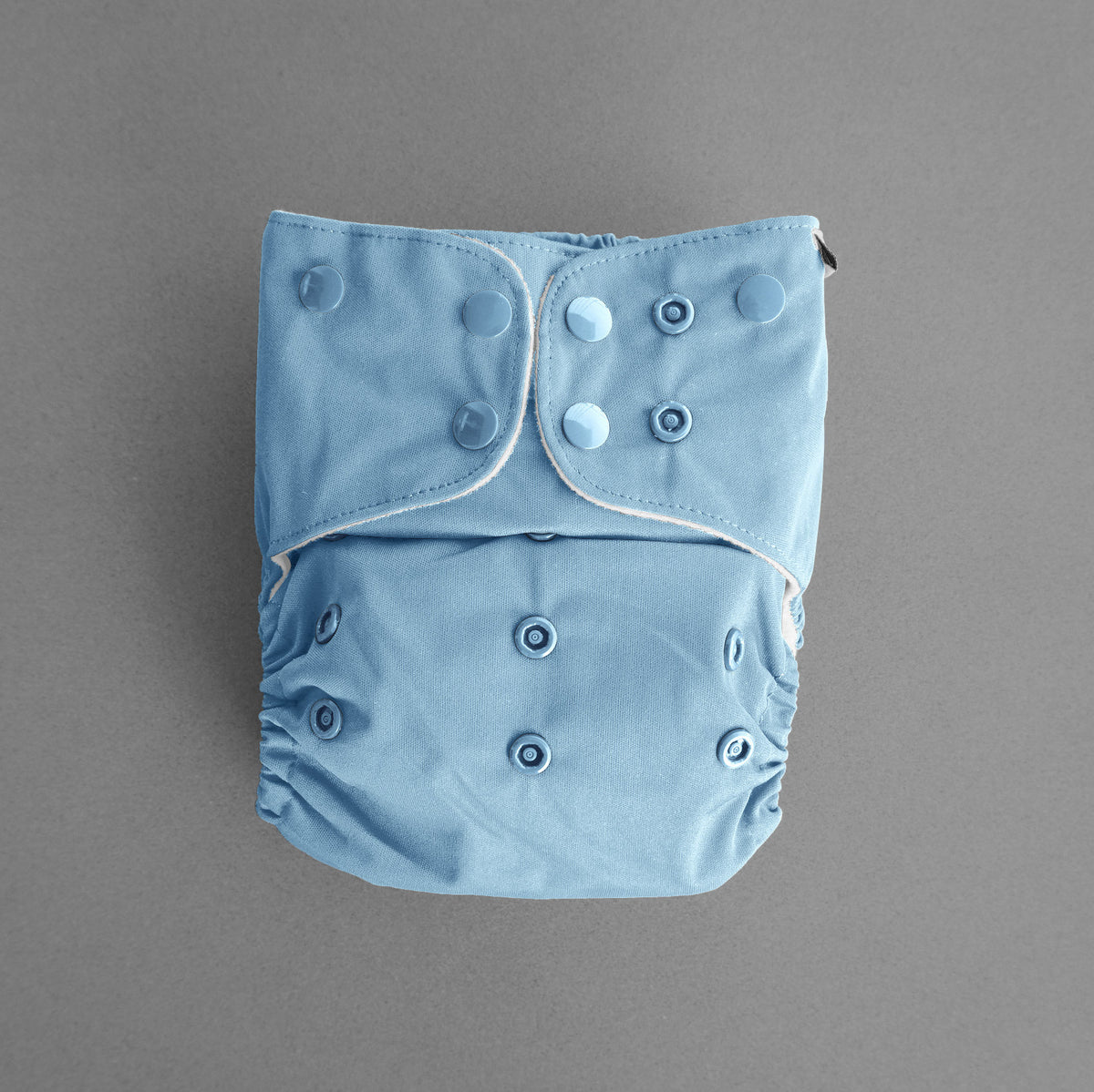 Enjoy the calming blue tones of our River modern cloth nappy. Ethically manufactured. Designed  and owned in Australia